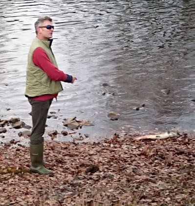 Simon Evans, WUFs Chief Executive, showing river walk attendees a spawned out Usk salmon