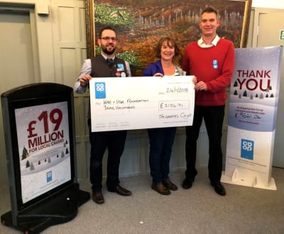 Will Lloyd, Store Manager of Talgarth Co-op (left) with Colette Mooney and Simon Evans